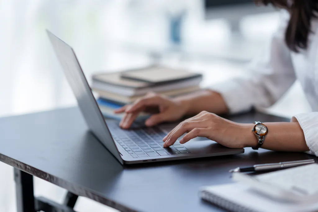 Close-up,Of,A,Business,Woman,Typing,A,Laptop,Computer,On